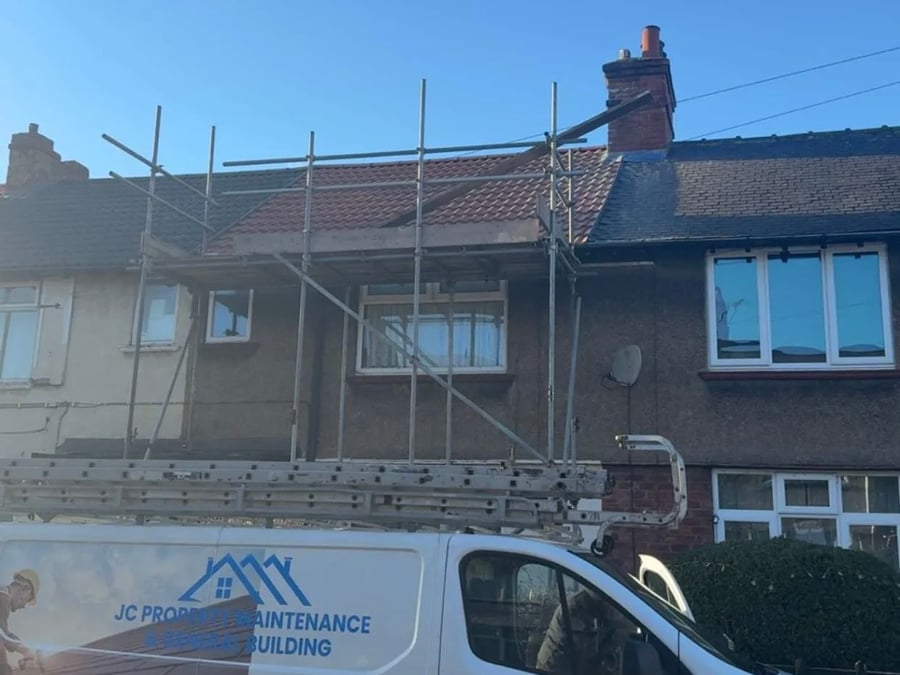 Scaffolding erected for roof work on a terraced house