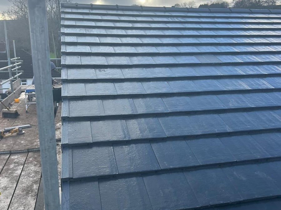 Roof tiling in progress from scaffolding